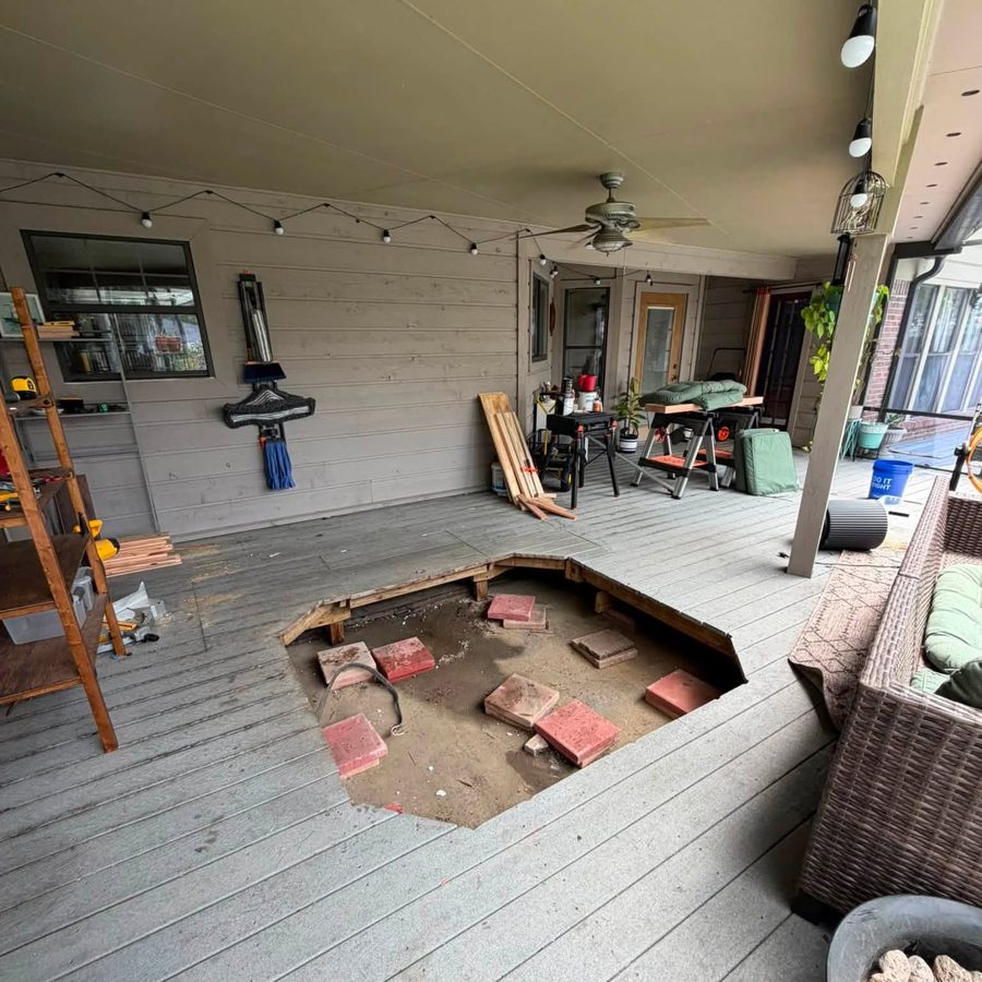 A covered deck with the hot tub taken out and the base left clear